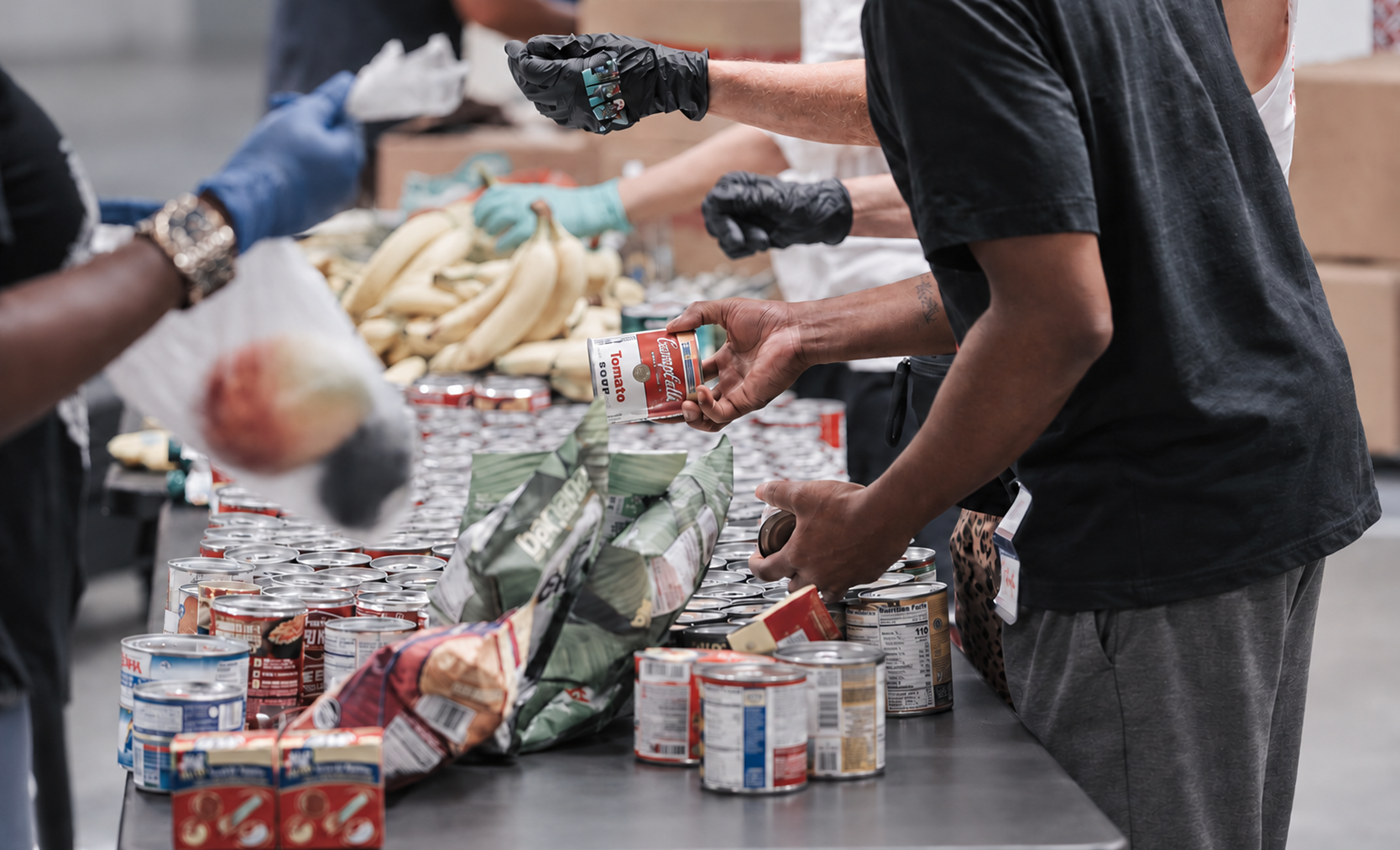 Volunteers sorting canned food donations